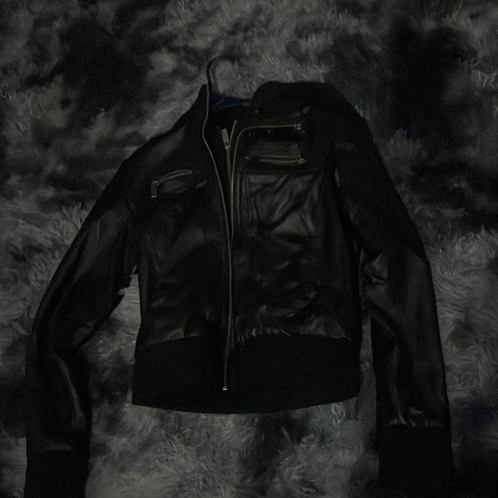 Leather jacket that has chest pockets and hoodie